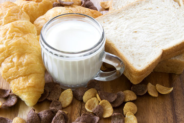 Breakfast with milk and  bread.