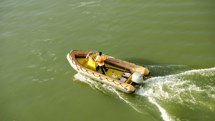 Rubber boat moving on sea