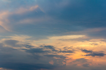 Naklejka na ściany i meble Sunset with partly cloudy sky. Dramatic sky