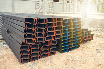 Stainless steel rectangular bars of meta on new construction site.