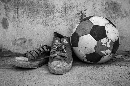 Old football and shoes.