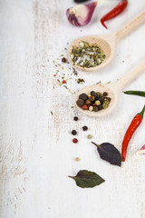 Vegetables and spices in a wooden table.