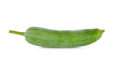 unpeeled fresh luffa gourd with stem on white background