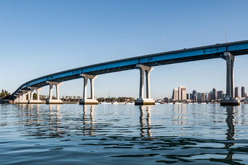 Downtown San Diego skyline in background with Coronado Bridge in the foreground.