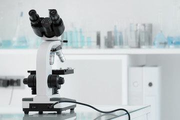 Laboratory lens of Microscope Isolated blue scientific research background.