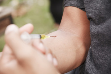 Doctor gives an intramuscular injection. Health and medicine concept.