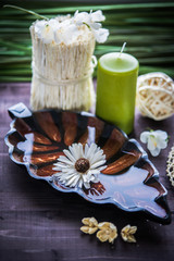 Accessories for spa.  White towels, orchid and stones for spa