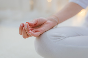 Yoga woman meditating and making a zen symbol with her hand