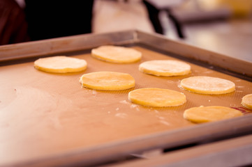 Freshly baked cookies on tray rack