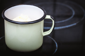iron mug melt butter on the stove