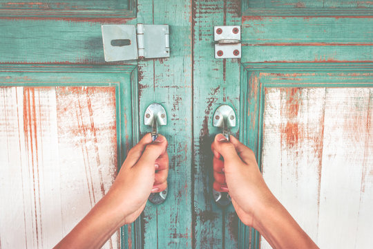 Asian Hand Holding A Metal Door Handle For Open The Ancient Wooden Slide Door. Open The Ancient Door For Back To The Past.