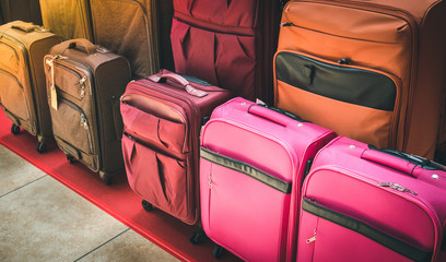 Luggage consisting of large suitcases rucksacks and travel bag. Travel luggage show case in shop.