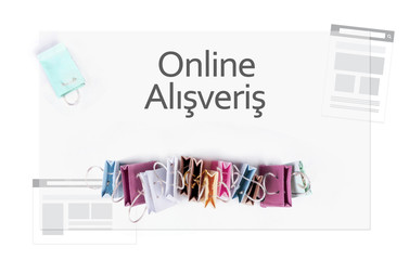 Online alisveris (online shopping) in Turkish language. E-commerce online shopping concept. Miniature of reusable grocery bags.