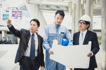 Asia businessman and engineer and looking up for the future, vintage color tone.