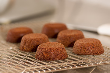 Delicious chocolate cake in a grating bakery