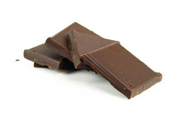 Chocolate cream and chocolate pieces on white background