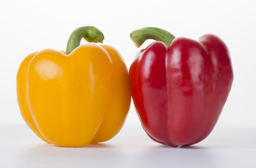 Colored bell peppers on the white background.