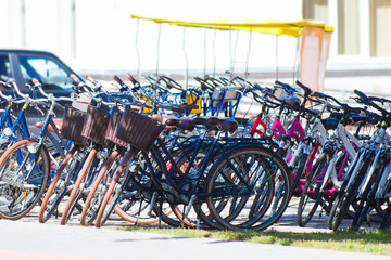Fototapeta na wymiar Bicycle parking area with group of colorful bicycles parked together