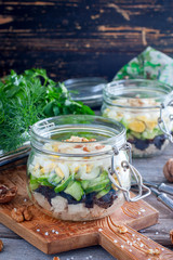 Fresh salad with boiled chicken breast, prune, egg and fresh cucumber, selective focus