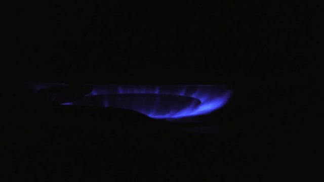 burning on a gas stove in the kitchen

