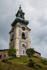 Fototapeta na wymiar Baroque church bell tower in Banska Stiavnica town, Slovakia