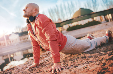 Sportsman stretching his body after training. Sport, fitness concept