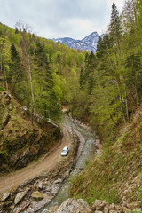Fototapeta na wymiar SUV car in the mountains