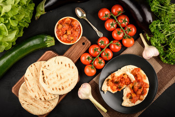 Pita bread with vegetable spread- mediterranean kitchen style. Top view.