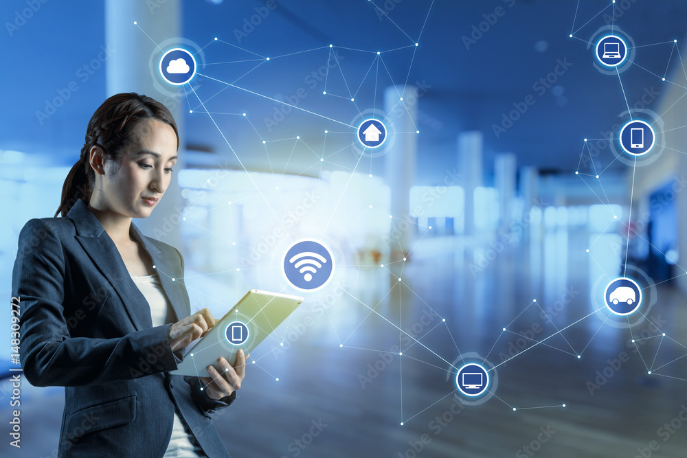 Poster young woman using tablet pc and internet of things concept. smart city. wireless communication netwo