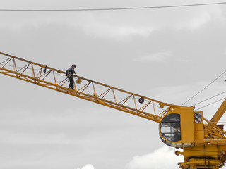 crane worker walking on steel crane