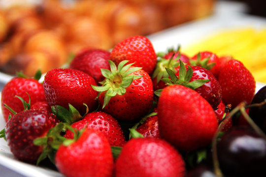 Strawberry:  is a widely grown hybrid species of the genus Fragaria (collectively known as the strawberries).