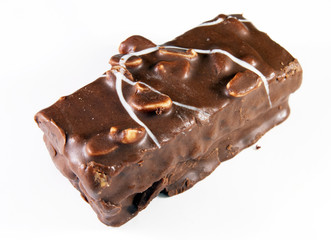 Chocolate cake with peanuts on a white background
