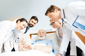 Doctors and senior patient