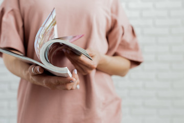 woman reading a magazine
