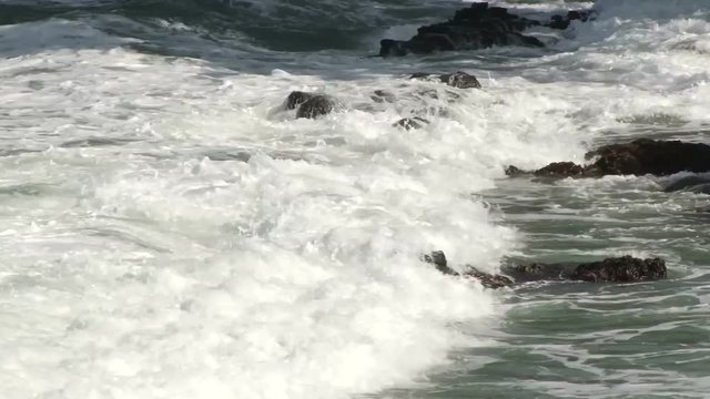 Close up of waves crashing ashore on a headland at La Toc Beach in St Lucia