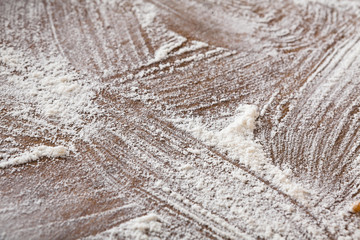 Baking concept on wood background, sprinkled flour with copy space