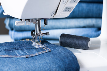 Sewing Machine Sew Jeans Fabric Close Up.