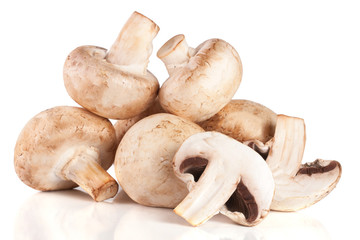 A bunch of champignon mushrooms isolated on white background