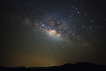 Fototapeta na wymiar Milky way galaxy with stars over moutain at Phu Hin Rong Kla National Park,Phitsanulok Thailand, Long exposure photograph.with grain