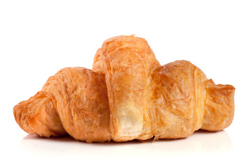 one croissant isolated on white background closeup