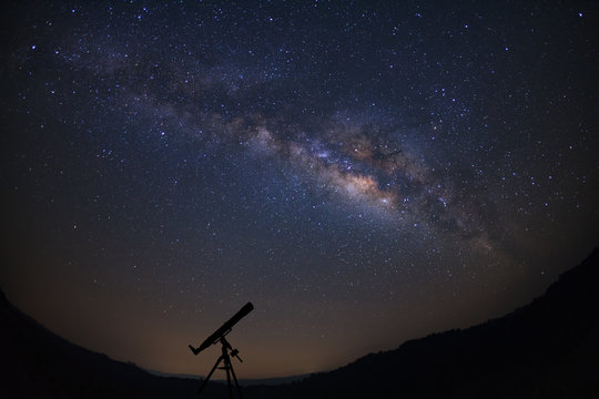 Telescopes with milky way galaxy, Night sky with stars, Long exposure photograph, with grain.