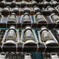 Decorative kerosene lamps in front of a mosque, as a symbol of religious mourning of Imam Husayn...