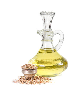 Sesame seeds and oil isolated on white background