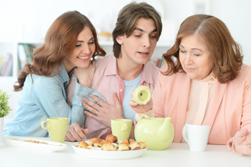 Obraz na płótnie Canvas Happy family drinking tea together
