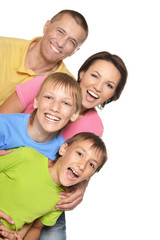 Happy family with young children on a white background