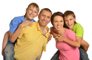 Happy family with young children on a white background