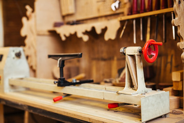 Background image of woodworking shop: wood cutting stand in empty carpenters studio on workstation
