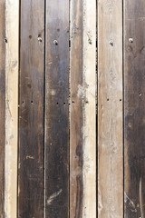 Natural brown wooden background from several rough boards