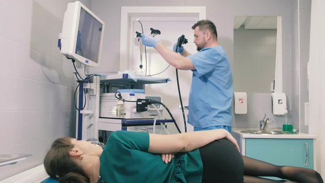 Doctor makes a gastroscopy young girl through the mouth 4k