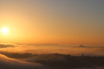 Obraz premium Sunset over the clouds